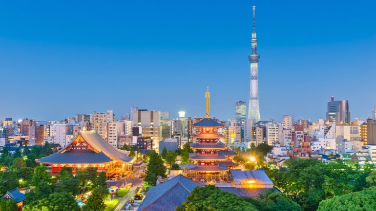 Tokyo skyline at dusk featuring Senso-ji Temple and Tokyo Skytree, showcasing the city’s blend of traditional and modern architecture.