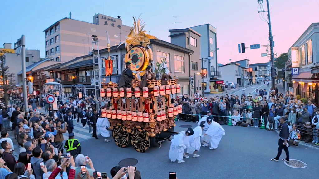 Crowds gather to watch a traditional float parade during the Takayama Spring Festival in Japan
